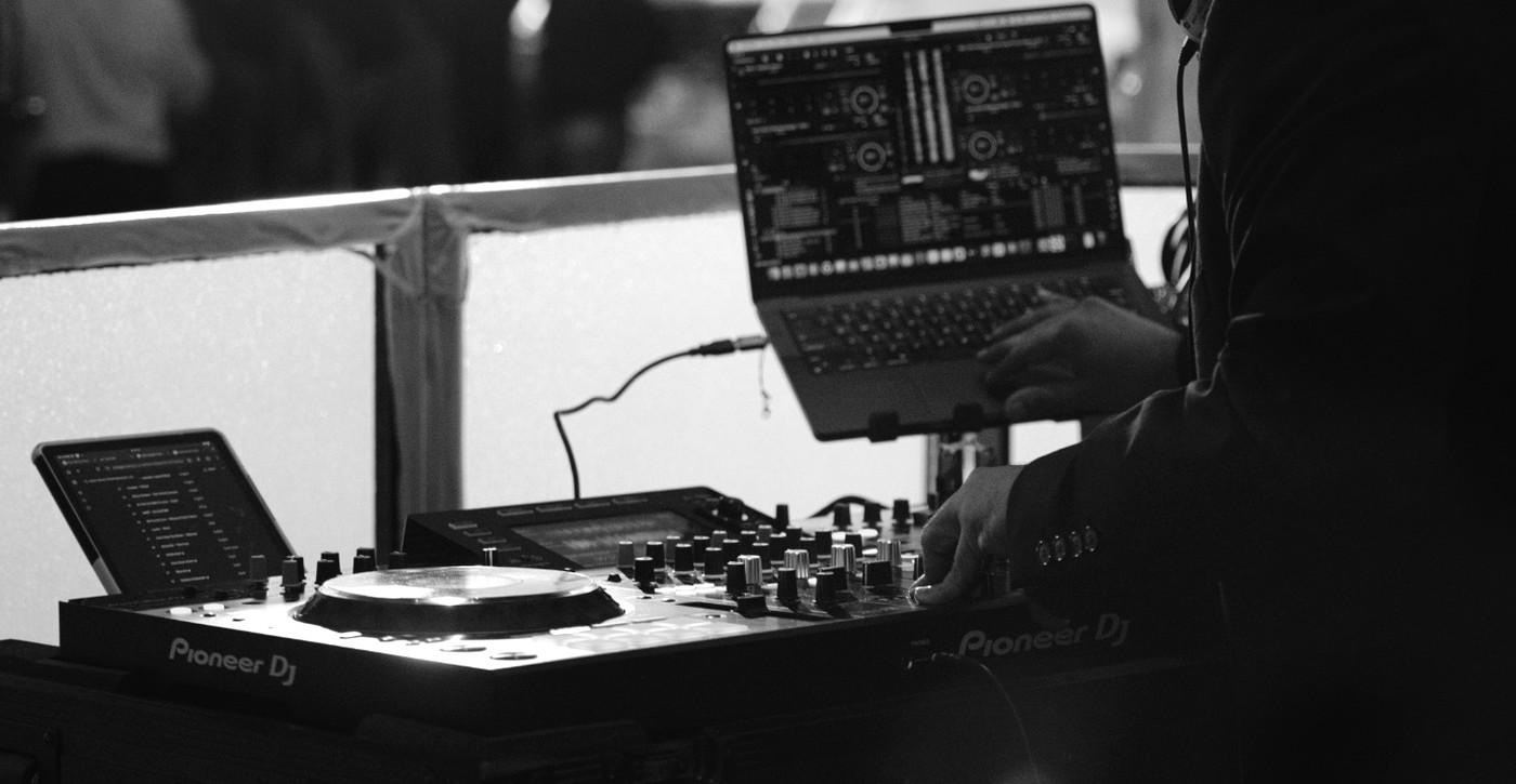 XME Pioneer DJ performance setup with controller and laptop